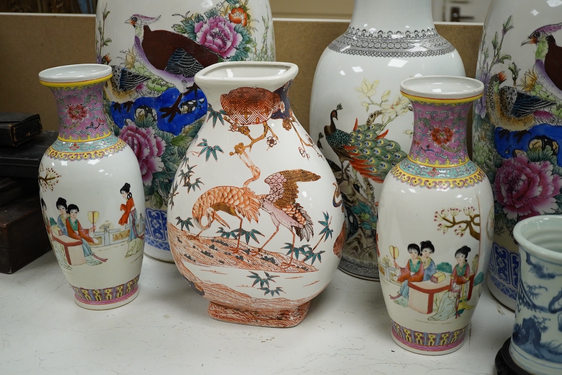 A large pair of Chinese polychrome vases, 60cm high, a pair of famille rose vases, a blue and white brushpot and two other vases (7).